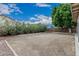 View of the backyard featuring a covered patio and mature landscaping at 705 W Country Estates Ave, Gilbert, AZ 85233