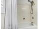 Bathroom featuring a shower-tub combo and built-in shelving at 705 W Country Estates Ave, Gilbert, AZ 85233