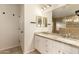 Bathroom with granite countertops, double sinks, a large mirror, and access to a large shower at 705 W Country Estates Ave, Gilbert, AZ 85233