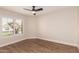 Bedroom with plantation shutters offering privacy and wood floors providing a sleek and modern look at 705 W Country Estates Ave, Gilbert, AZ 85233