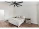 Well-lit bedroom featuring wood floors, neutral walls, and modern ceiling fan at 705 W Country Estates Ave, Gilbert, AZ 85233
