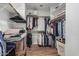 Walk-in closet with built-in shelving and ample storage space for clothes and accessories at 705 W Country Estates Ave, Gilbert, AZ 85233