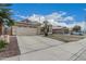 Attractive home featuring a spacious driveway and a two-car garage at 705 W Country Estates Ave, Gilbert, AZ 85233