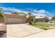 A well maintained house exterior is visible with a two car garage and small palms at 705 W Country Estates Ave, Gilbert, AZ 85233