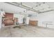 Spacious garage with storage cabinets, overhead shelving, and room for parking at 705 W Country Estates Ave, Gilbert, AZ 85233