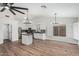 Spacious kitchen area with pendant lighting, stainless steel appliances, and white cabinetry at 705 W Country Estates Ave, Gilbert, AZ 85233