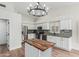 Well-equipped kitchen with stainless steel appliances and a kitchen island at 705 W Country Estates Ave, Gilbert, AZ 85233