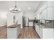 Bright eat-in kitchen featuring stainless steel appliances and a kitchen island at 705 W Country Estates Ave, Gilbert, AZ 85233