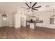 An open floor plan view showcasing the seamless flow between the kitchen and living area at 705 W Country Estates Ave, Gilbert, AZ 85233