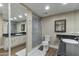 Bathroom with a glass enclosed shower and granite countertop on a white vanity at 7840 E Camelback Rd # 110, Scottsdale, AZ 85251