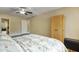 Bedroom with wood-look floors and a ceiling fan for comfort and style at 7840 E Camelback Rd # 110, Scottsdale, AZ 85251