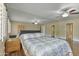 Bedroom with wood-look floors, large mirrors, and neutral paint for a serene feel at 7840 E Camelback Rd # 110, Scottsdale, AZ 85251