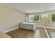 Bright bedroom with wood floors and large window offering natural light and desert views at 7840 E Camelback Rd # 110, Scottsdale, AZ 85251