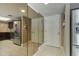 Entryway with closet and view into the kitchen with tile floor and stainless steel refrigerator at 7840 E Camelback Rd # 110, Scottsdale, AZ 85251