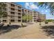 Exterior view of building with well-maintained landscaping and gravel ground cover at 7840 E Camelback Rd # 110, Scottsdale, AZ 85251