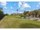 Scenic view of lush green space, water feature, and walkway bridge near the building at 7840 E Camelback Rd # 110, Scottsdale, AZ 85251