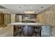 Kitchen featuring granite countertops, stainless steel refrigerator, and beverage cooler at 7840 E Camelback Rd # 110, Scottsdale, AZ 85251