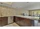 Kitchen with sleek stainless steel dishwasher and ample storage below granite countertops at 7840 E Camelback Rd # 110, Scottsdale, AZ 85251