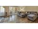 Spacious living room boasts a sectional sofa and sliding doors for indoor-outdoor flow at 7840 E Camelback Rd # 110, Scottsdale, AZ 85251