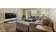 Inviting living room features a gray sectional sofa and sliding doors for natural light at 7840 E Camelback Rd # 110, Scottsdale, AZ 85251