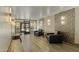 Stylish lobby with tile floors, decorative wall paper, seating area and secure access to building at 7840 E Camelback Rd # 110, Scottsdale, AZ 85251
