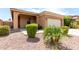 Charming single-story home with a well-manicured front yard with desert landscaping and covered entryway at 903 E Jacob St, Chandler, AZ 85225