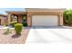Charming single-story home with a well-manicured front yard with desert landscaping and a two-car garage at 903 E Jacob St, Chandler, AZ 85225