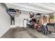 Organized garage space with storage shelves, bicycles, water heater and various household items at 903 E Jacob St, Chandler, AZ 85225