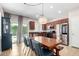 Bright kitchen area with stainless steel appliances, dark wood cabinets, and a view to outdoor pool area at 903 E Jacob St, Chandler, AZ 85225