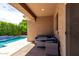 Covered patio area with comfortable seating, ideal for outdoor entertainment by the pool at 903 E Jacob St, Chandler, AZ 85225