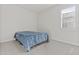 Well-lit bedroom featuring carpet flooring and a window with plantation shutters, offering privacy and style at 9303 W Oregon Ave, Glendale, AZ 85305