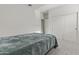 Minimalist bedroom with carpet flooring and large closet with sliding doors at 9303 W Oregon Ave, Glendale, AZ 85305