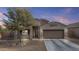 Inviting single-story home featuring a desert landscaped front yard and a convenient two-car garage at 9303 W Oregon Ave, Glendale, AZ 85305