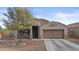 Charming single-Gathering home boasting desert landscaping, a two car garage, and neutral stucco at 9303 W Oregon Ave, Glendale, AZ 85305