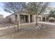 Charming single-story home with desert landscaping, a covered porch, and a two-car garage at 9303 W Oregon Ave, Glendale, AZ 85305