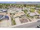 An aerial view of the property highlights the mature landscaping and proximity to mountain views at 9466 E Laurel Ln, Scottsdale, AZ 85260