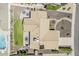 Aerial view of backyard featuring patio, fire pit, manicured lawn and refreshing pool at 9466 E Laurel Ln, Scottsdale, AZ 85260