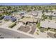 Aerial view of home showcasing desert landscaping, a well-maintained lawn, and neighborhood at 9466 E Laurel Ln, Scottsdale, AZ 85260