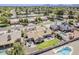 Aerial view of home with a backyard featuring artificial grass, patio, and desert landscaping at 9466 E Laurel Ln, Scottsdale, AZ 85260