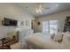 Bright bedroom with large bed, backyard view, and stylish dresser at 9466 E Laurel Ln, Scottsdale, AZ 85260