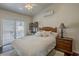 Cozy bedroom with backyard access, desk, and comfortable furnishings at 9466 E Laurel Ln, Scottsdale, AZ 85260