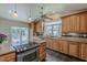 Spacious kitchen with granite counters, ample cabinets, and backyard view at 9466 E Laurel Ln, Scottsdale, AZ 85260