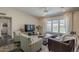 Bright living room with large windows, comfortable seating, and modern decor elements at 9466 E Laurel Ln, Scottsdale, AZ 85260
