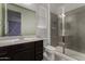 Bathroom featuring vanity with dark cabinets and glass walk-in shower at 9548 E Rainbow Ave, Mesa, AZ 85212