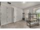 Bright bedroom featuring natural light and closet with unique doors at 9548 E Rainbow Ave, Mesa, AZ 85212