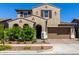 Charming two-story home with a desert landscape, two-car garage and tasteful architectural details at 9548 E Rainbow Ave, Mesa, AZ 85212