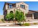 Charming two-story home with a desert landscape, two-car garage and tasteful architectural details at 9548 E Rainbow Ave, Mesa, AZ 85212
