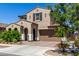 Charming two-story home with a desert landscape, two-car garage and tasteful architectural details at 9548 E Rainbow Ave, Mesa, AZ 85212
