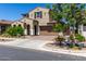 Charming two-story home with a desert landscape, two-car garage and tasteful architectural details at 9548 E Rainbow Ave, Mesa, AZ 85212