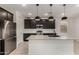 Modern kitchen featuring stainless steel appliances, a large island and white subway tile backsplash at 9548 E Rainbow Ave, Mesa, AZ 85212